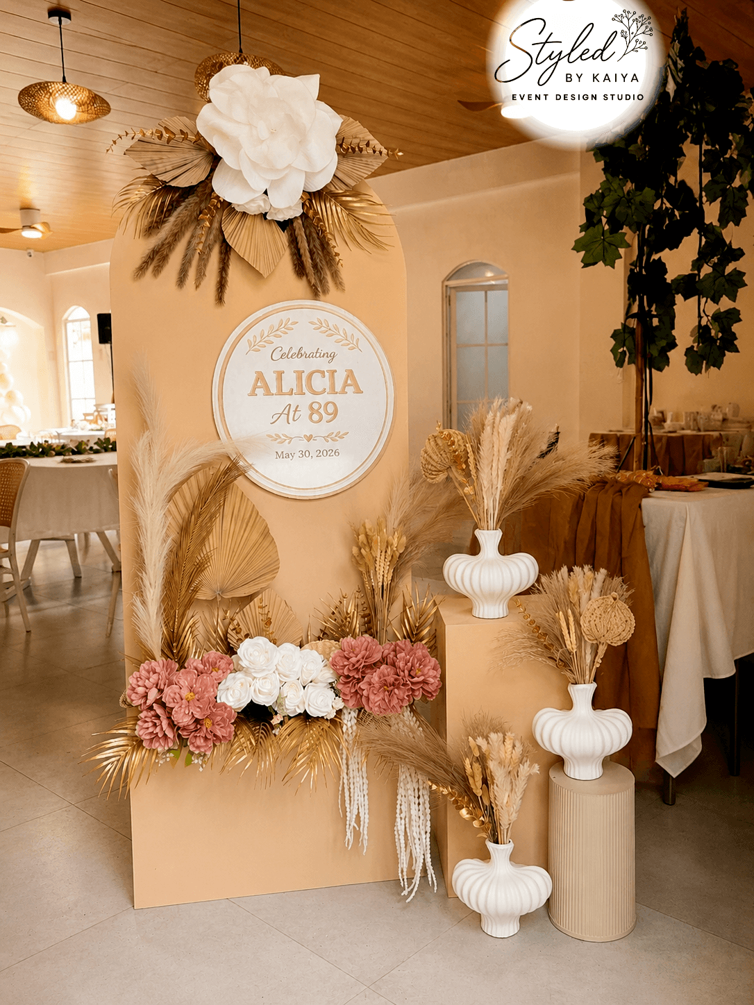 Alicia's 89th birthday bohemian gold backdrop with pampas grass and vintage vases
