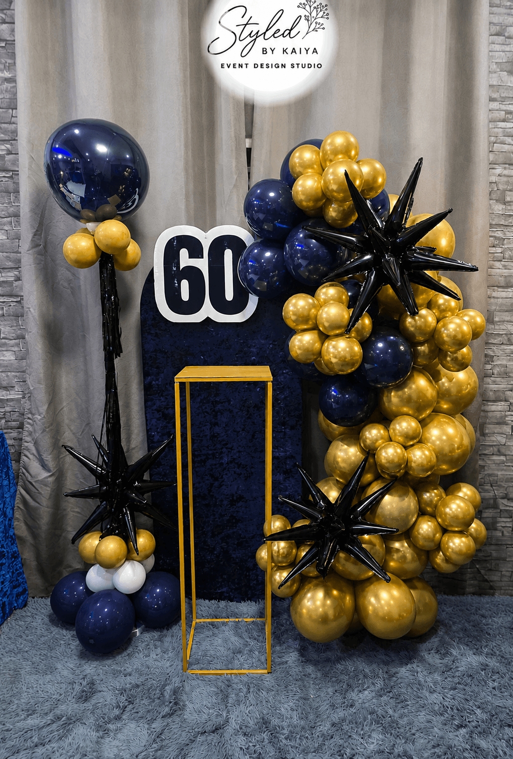 60th birthday navy and gold chrome balloon tower with starburst accents
