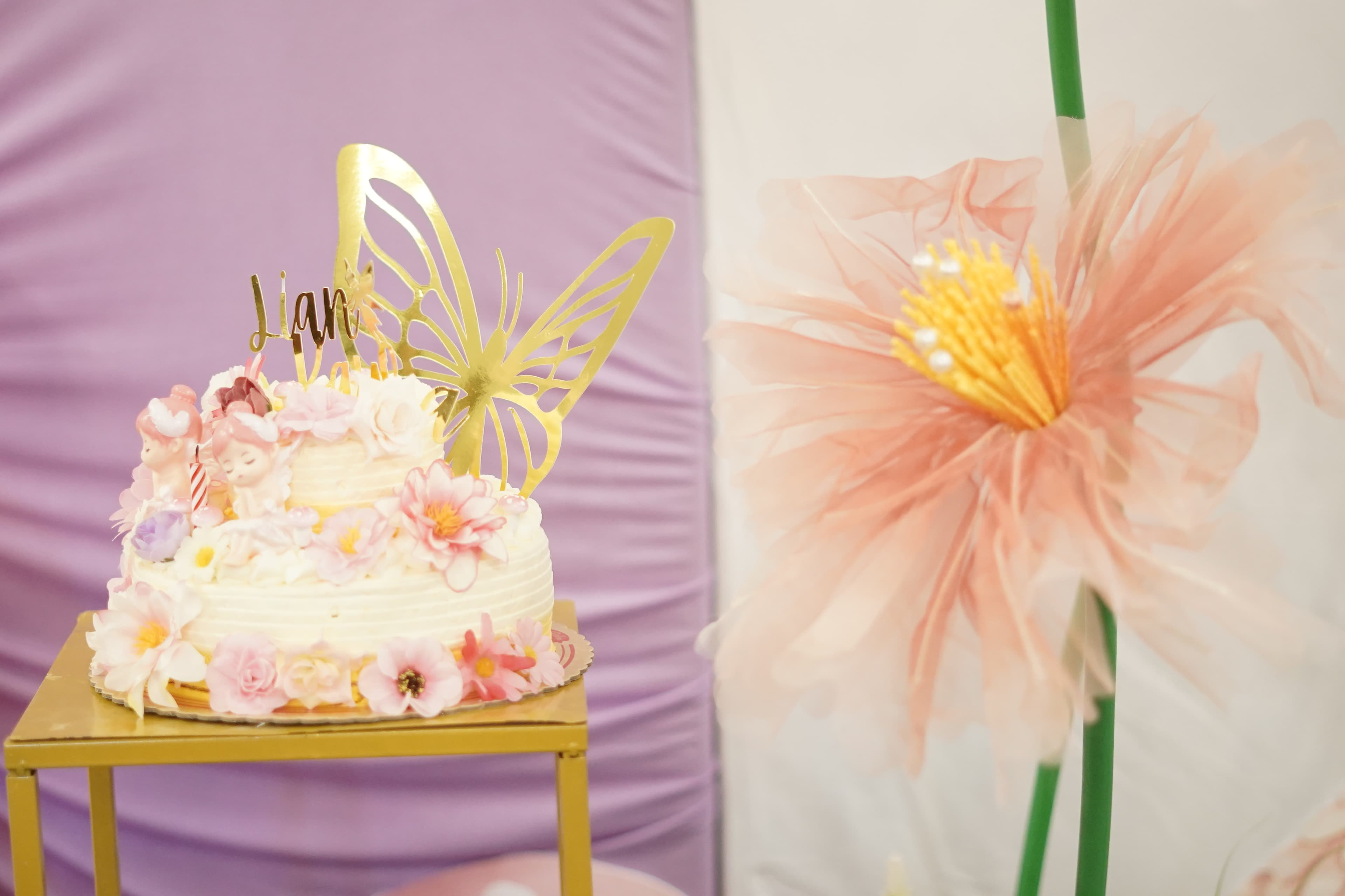 Butterfly birthday cake with floral sugar flowers for Lian Kayla's 1st birthday