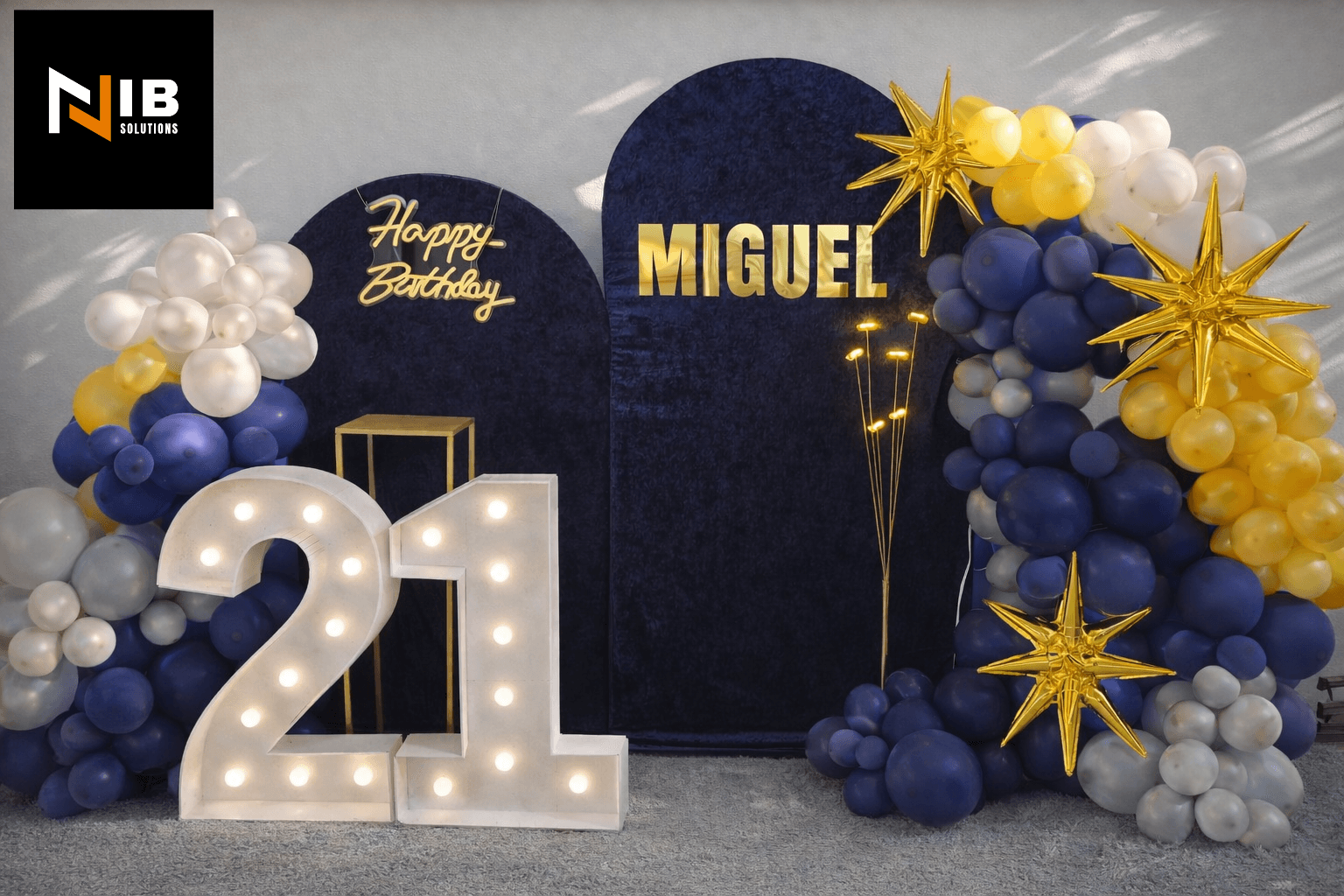 Miguel's 21st birthday main arched backdrop with gold starburst details