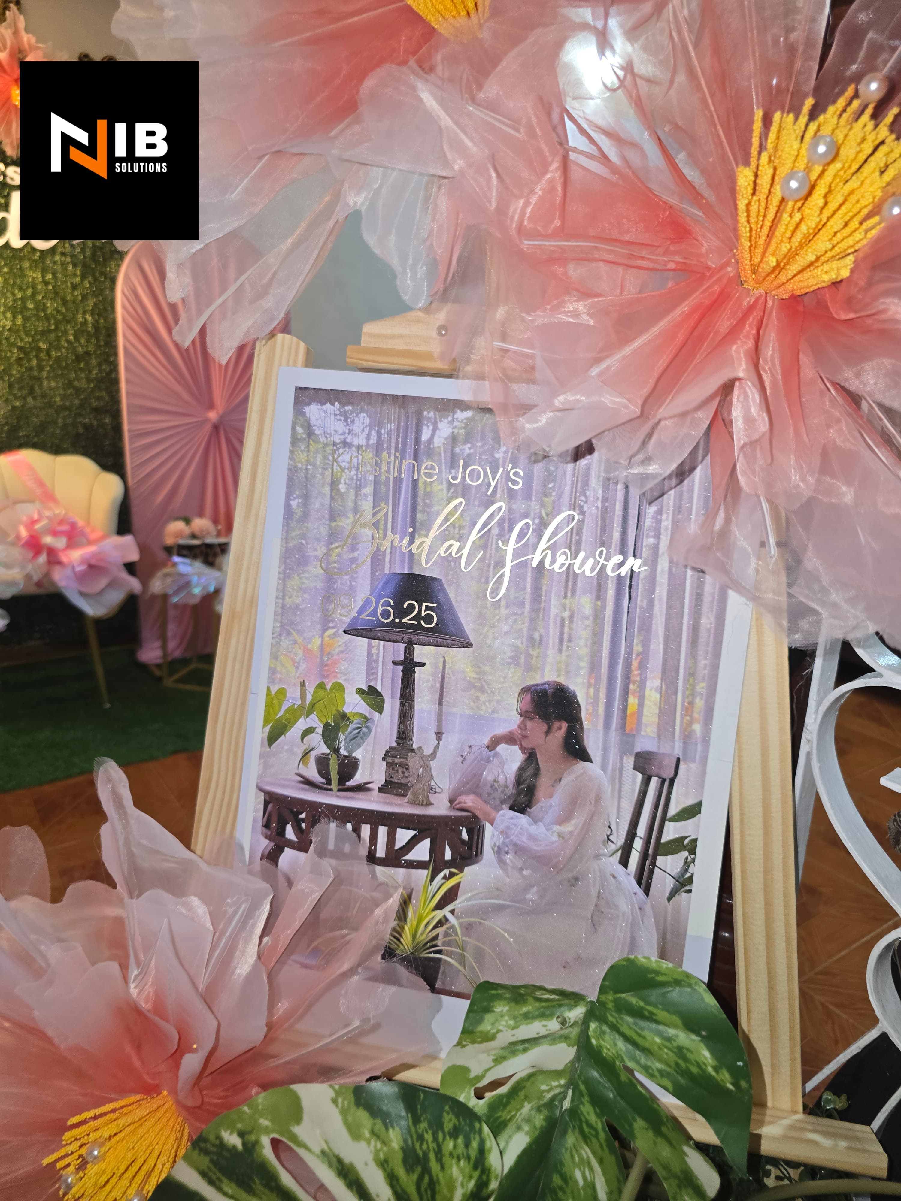 Bridal shower welcome sign with large paper peony flowers and butterflies